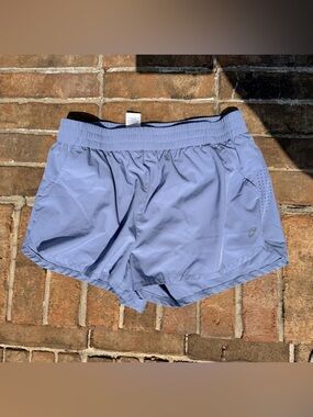 Women’s Light Blue ASICS running shorts with pockets (Large)